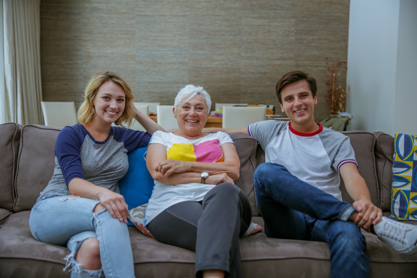 Host mom relaxing on the couch with two students